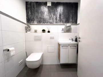 Gäste-WC - Elegante Maisonettewohnung mit großzügigem Raumkonzept und Balkon zum Wohlfühlen!